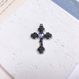 Gothic black alloy cross pendant with iridescent heart gem and relief rose details