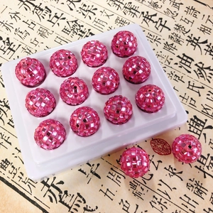 Macro detail of sparkly pink disco ball spacer beads for DIY phone chains and accessories
