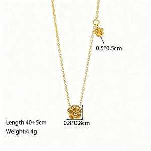 Detail of rose pendant necklace in gold finish with dual flower charms and thin chain