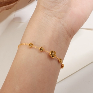 Elegant gold-tone camellia flower charm bracelet in stainless steel for women