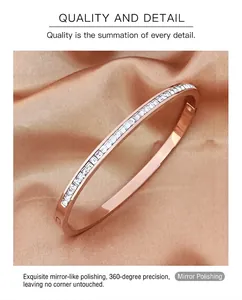 Macro shot of rose gold titanium bracelet featuring square cut crystals on silk background