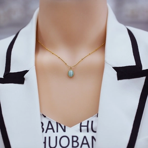 French vintage 18k gold plated necklace with oval blue cat eye stone pendant and gold beads