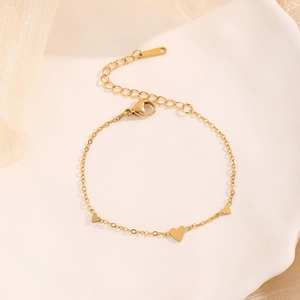 Minimalist gold plated stainless steel heart bracelet with three charms and extender chain