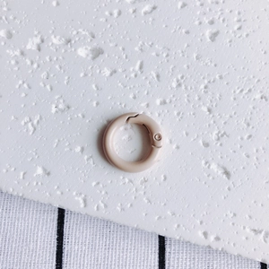 Detail view of a 20mm matte pink round spring gate ring clasp for DIY keychains