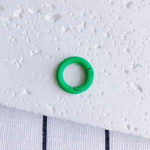 Detail of matte grass green spring gate ring clasp for DIY jewelry and keychain