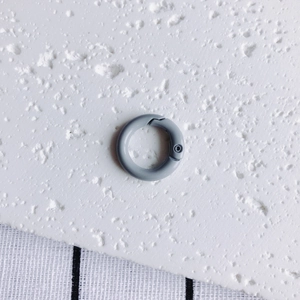 Close-up of a 20mm grey matte spring ring gate for DIY jewelry and keychains