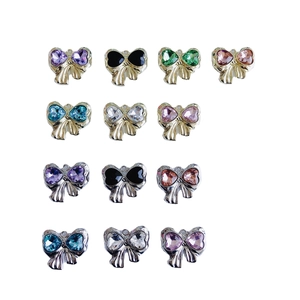 Bow-shaped DIY jewelry charms with heart-shaped zircon stones in gold and silver finish