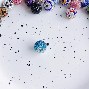 Macro detail of a 10mm sparkling blue rhinestone disco ball bead for DIY jewelry making