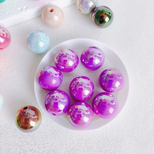 Detail of 16mm colorful acrylic beads with metallic laser coating for DIY jewelry