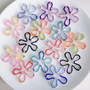 Detail of hollow five-petal flower glass beads with colorful hand-painted wavy edges