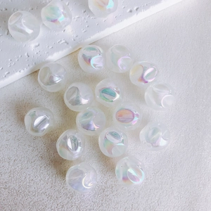 Detailed view of 16mm translucent white aurora acrylic beads for DIY jewelry making