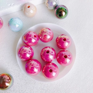 Macro view of 16mm vibrant laser-plated acrylic beads for DIY jewelry making