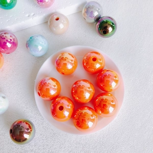 Macro shot of colorful 16mm iridescent acrylic beads for DIY jewelry making and crafts