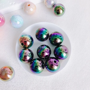 Close-up of 16mm aurora acrylic beads with iridescent metallic finish for DIY jewelry