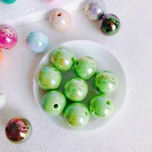 Detailed macro view of 16mm colorful acrylic beads with iridescent finish for DIY jewelry