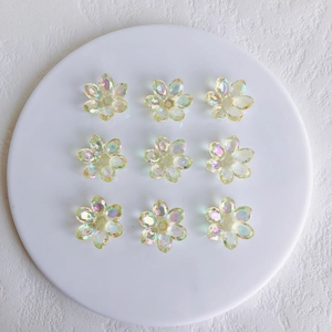 Macro shot of 9 colorful aurora AB acrylic flower charms for DIY jewelry making