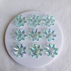 Macro view of transparent Aurora AB acrylic lotus flower charms for DIY jewelry making