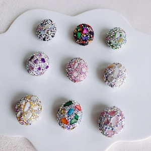 Macro shot of 9 colorful floral rhinestones beads for DIY jewelry making and craft decor