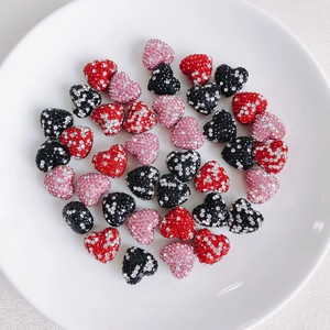 DIY sparkling heart-shaped beads with full rhinestone pavé in red, pink, and black colors