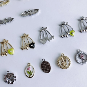 Detailed assortment of DIY alloy charms including cherry, heart, and flower for jewelry