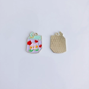 Detail of peach drink charm accessories with colorful drip oil finish and golden grid back