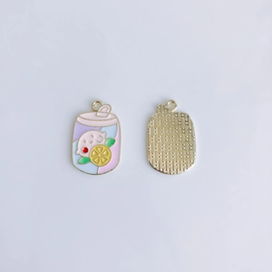 Detail of colorful enamel peach drink charms with textured gold metal back for DIY jewelry