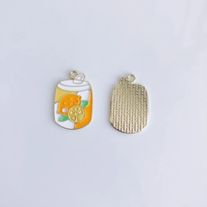 Detail of DIY alloy beverage charms showing orange citrus patterns and textured gold back
