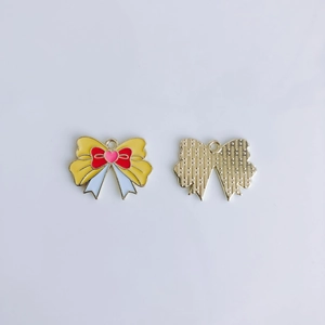 Detail view showing front and back of gold-plated yellow enamel butterfly pendant