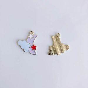 Detailed front and back view of alloy crescent moon pendants with purple enamel and stars