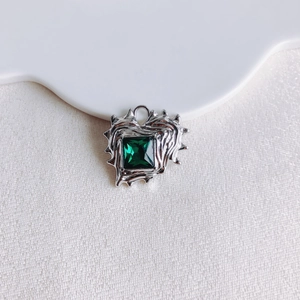 Irregular heart pendant featuring square emerald-cut green zircon and silver fluid metal