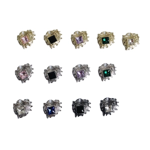 Irregular heart zircon necklaces and earrings in gold, silver, and black metal settings