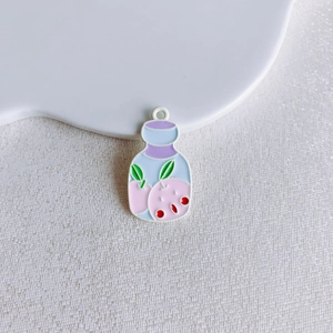 Detail of peach bottle charm with colorful enamel inlay and top hanging hole