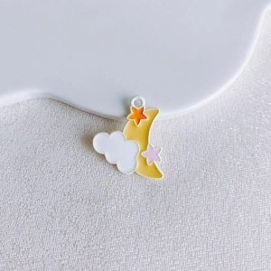 Detailed view of yellow crescent moon and white cloud enamel pendant charm for DIY jewelry