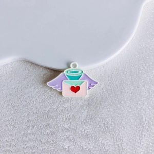 Detailed view of DIY alloy envelope pendant with wings, pink heart, and halo for jewelry making