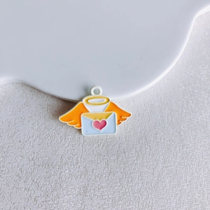 Detail of light blue enamel envelope pendant with pink heart and orange angel wings
