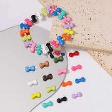 Macro detail of macaron flower alloy beads for DIY jewelry and handmade accessories