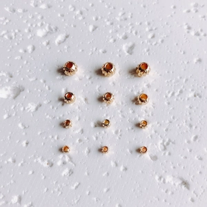 Détail de perles d'espacement remplies d'or 14K avec texture spirale en quatre tailles
