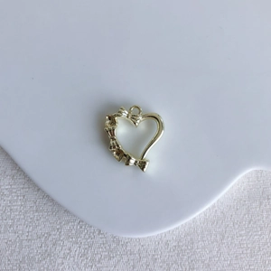 Golden heart pendant with three bow details for DIY necklace and bracelet jewelry making
