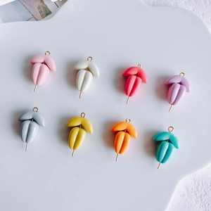Set of eight colorful grain-shaped resin charms with gold hooks for DIY jewelry making