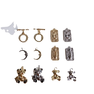 Golden and silver mini OT buckles with moon and bear charms for DIY jewelry making