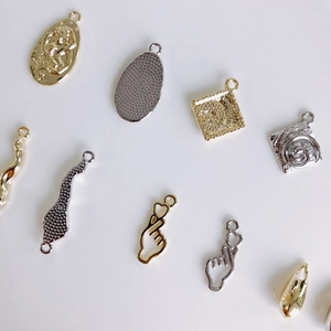 DIY jewelry pendants set in gold and silver finish with embossed patterns for necklace