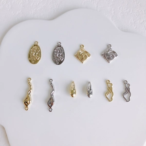 Collection of gold and silver sun charms and irregular links for DIY jewelry making