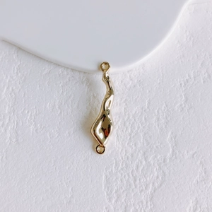 Detailed view of gold-plated irregular solar disc connector for DIY jewelry making