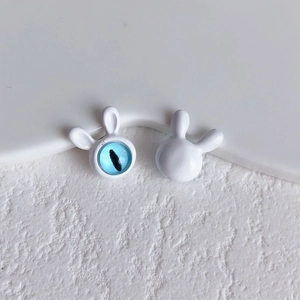 Detailed close-up of cute white rabbit DIY beads featuring a blue evil eye stone insert
