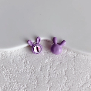 Detailed view of purple bunny alloy beads for DIY jewelry with hand-painted eyes