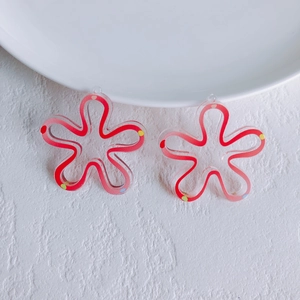 Close-up of floral acrylic beads with colorful wave patterns for DIY jewelry making