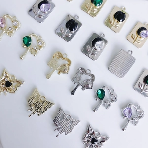 DIY jewelry charms featuring luxury tulips and butterfly pendants with rhinestones