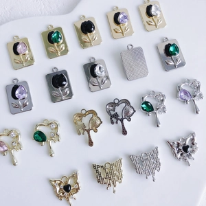 Assorted alloy jewelry pendants featuring heart, butterfly and tulip shapes for DIY necklaces
