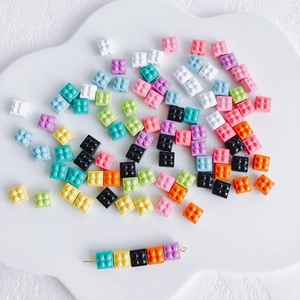 Macro shot of colorful building block style beads for DIY necklaces and phone charms