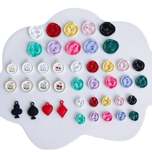 Collection of colorful resin buttons and floral alloy pendants for DIY jewelry making